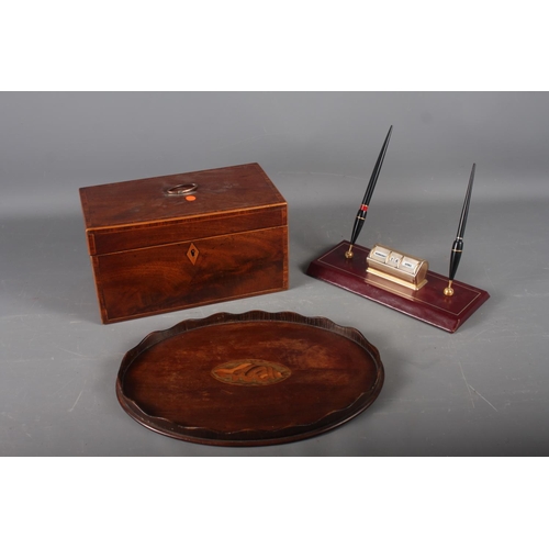 165 - An early 20th century mahogany and banded tea caddy, 10 1/4