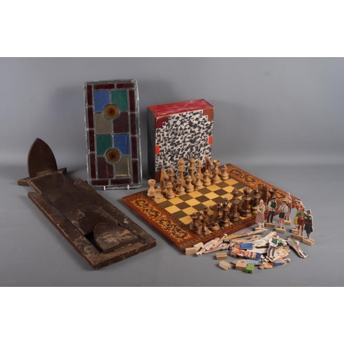 184 - A marquetry chess board with wooden chess pieces, a quantity of 