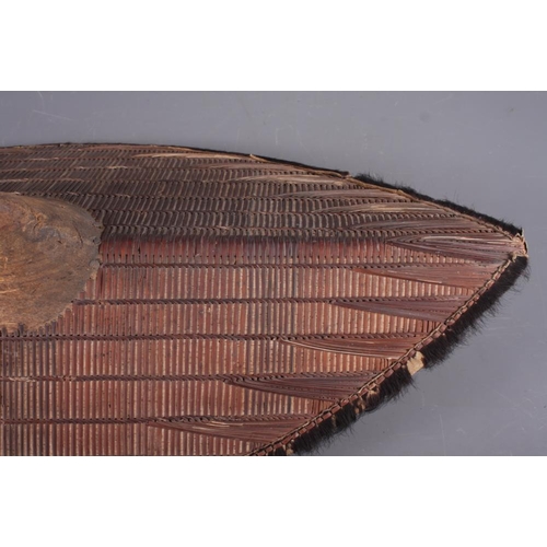 191 - Two Ganda shields with traditional woven rattan design and  fur borders, 30