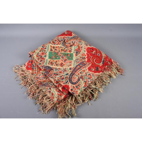 204 - A 19th century printed paisley type shawl, 52