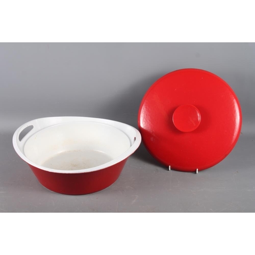 228 - A Danish 1960s cast iron red and white enamelled casserole dish, a stainless steel candlestick, mixe... 