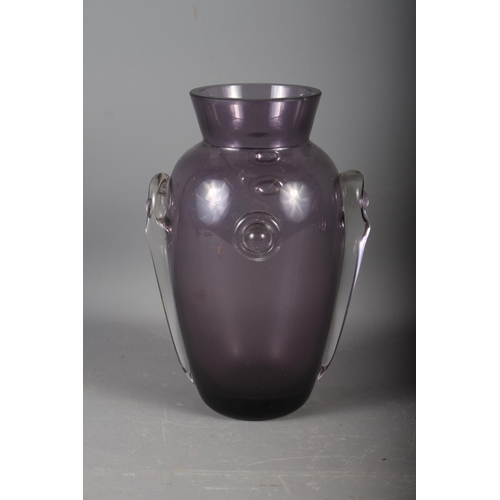 23 - An early 20th century amethyst glass vase with applied decoration, 10