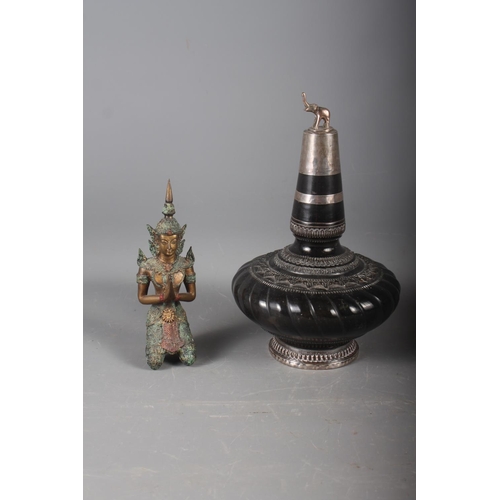 235 - An Indian ceramic and white metal bottle neck vase with elephant finial, 10 1/4