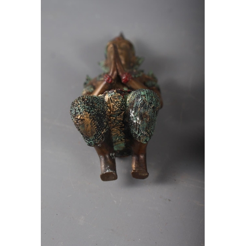 235 - An Indian ceramic and white metal bottle neck vase with elephant finial, 10 1/4