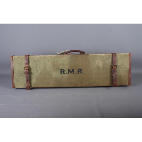 238 - A green canvas and leather bound gun case, initialled 