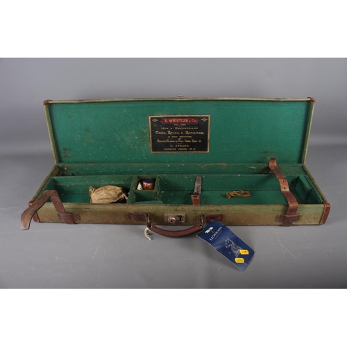 238 - A green canvas and leather bound gun case, initialled 