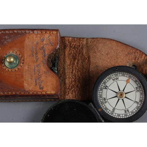 241 - A WWI compass in leather case, an apothecary's balance and weights, in wooden case, and a similar ba... 