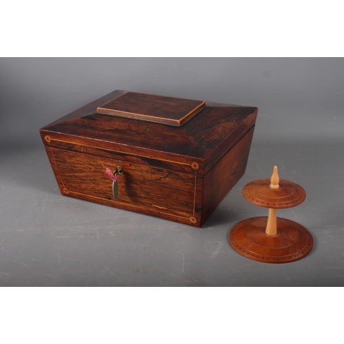 254 - A rosewood sarcophagus sewing box and a quantity of sewing accessories, including needles, coloured ... 