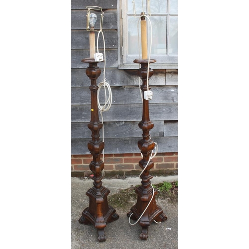 271 - A pair of polished as walnut standard lamps with faceted columns, on three scroll supports