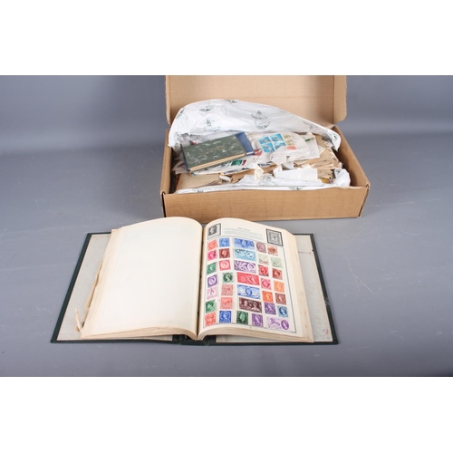 284 - An Ajax stamp album, containing stamps from around the world, a box, containing a quantity of loose ... 