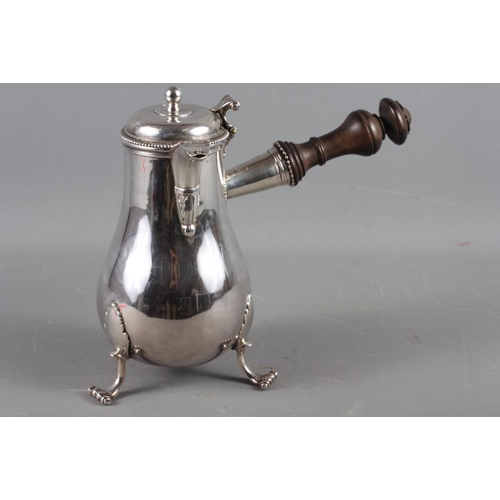 321 - An 18th century French silver chocolate pot with turned ebonised handle and dragon armorial, maker's... 