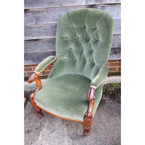 428 - A Victorian mahogany open armchair, button upholstered in a green velour, on turned and carved suppo... 