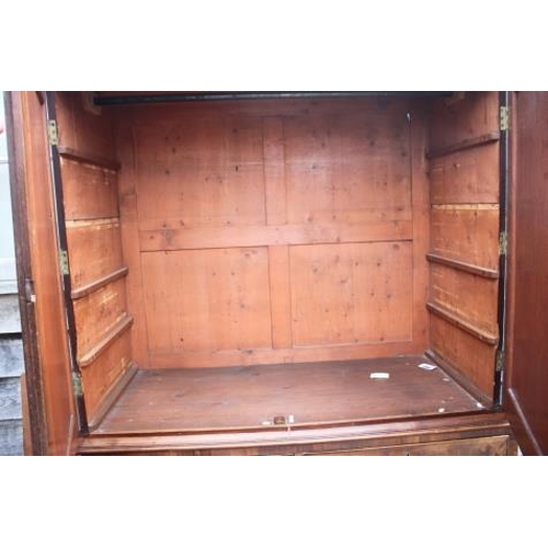 435 - A late Georgian figured mahogany linen press, the upper section enclosed two doors over two short an... 