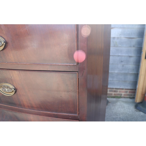 436 - An early 19th century figured mahogany bowfront chest of two short and five graduated long drawers w... 