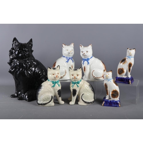 45 - A black glazed model of a cat, 13