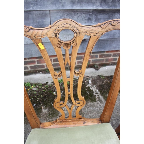 453 - A set of four late Georgian carved ash and fruit wood side chairs with stuffed over seats and pierce... 