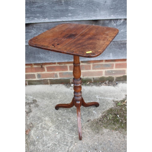 457 - An early 19th century mahogany and rosewood banded square tilt top occasional table, on turned colum... 