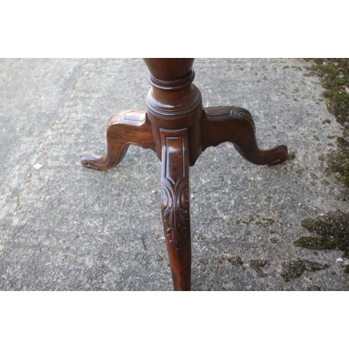 458 - A George III Cuban mahogany circular tilt top occasional table, on vase turned column, acanthus carv... 