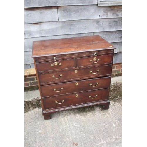 461 - A bachelor's George III mahogany chest of two short and three graduated long drawers with slide, on ... 