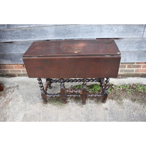 480 - An early 18th century walnut single drop leaf side table, on barley twist turned and stretchered sup... 