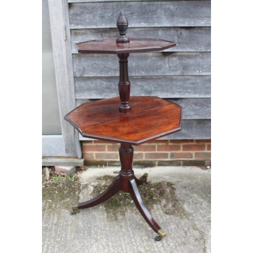 481 - A Georgian mahogany two-tier octagonal drop leaf dumb waiter, on turned column and tripod splay supp... 