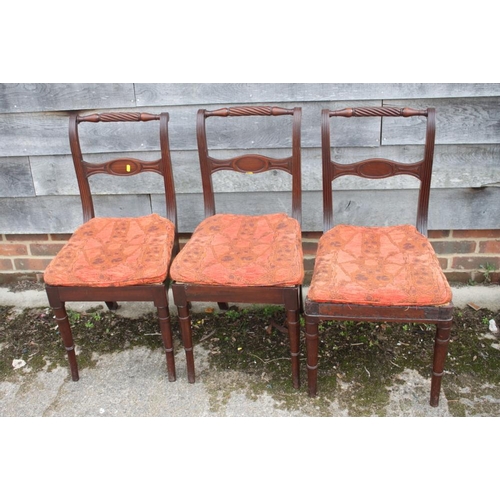 486 - A set of seven 19th century mahogany side chairs with loose seat squabs, oval carved bar backs and r... 