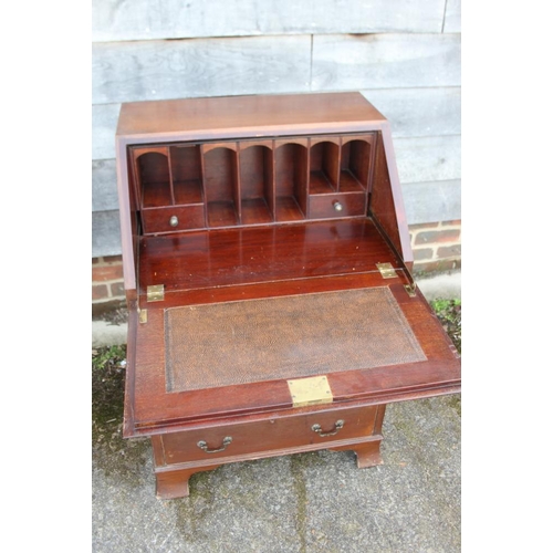 518 - A mahogany and banded fall front bureau with fitted interior over four long drawers, on bracket feet... 