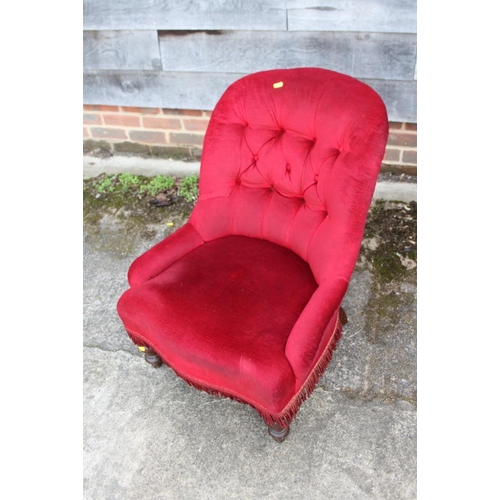 519 - A tub shape occasional chair, button upholstered in a red Dralon, on turned supports