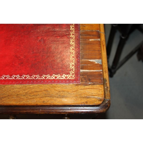 552 - An Edwardian oak double pedestal desk with red leather lined top, fitted nine drawers, on block base... 