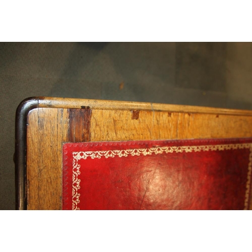 552 - An Edwardian oak double pedestal desk with red leather lined top, fitted nine drawers, on block base... 