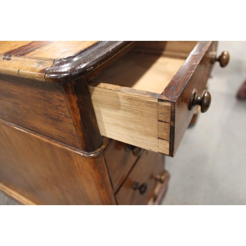 552 - An Edwardian oak double pedestal desk with red leather lined top, fitted nine drawers, on block base... 