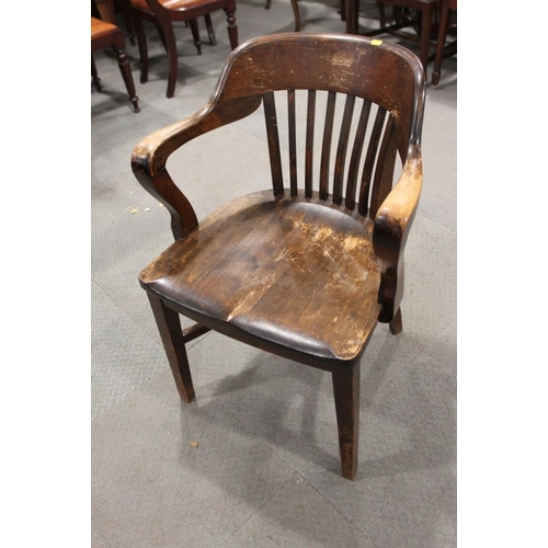 557 - A 1930s polished as walnut desk elbow chair with panel seat, on square taper stretchered supports