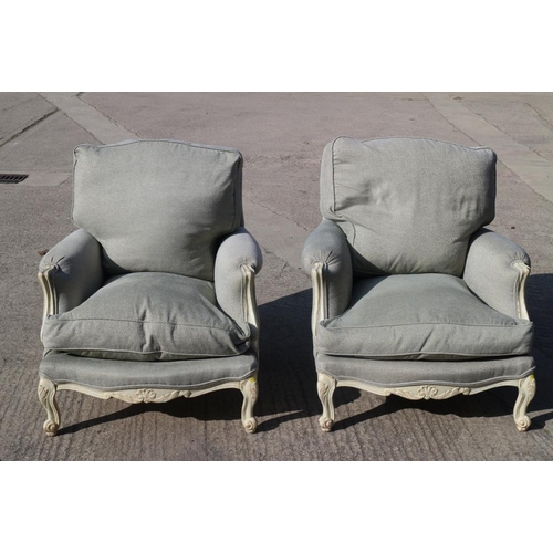 560 - A pair of Louis XVI design white painted showframe deep seat armchairs with down loose seat and back... 