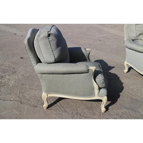 560 - A pair of Louis XVI design white painted showframe deep seat armchairs with down loose seat and back... 