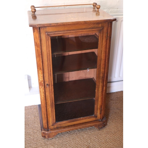 579 - An early 20th century figured walnut and inlaid music cabinet enclosed glazed panel door, on bracket... 