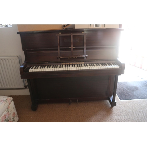 582 - A W H Barnes iron frame overstrung full trichord, check action upright piano, in walnut case
COLLECT