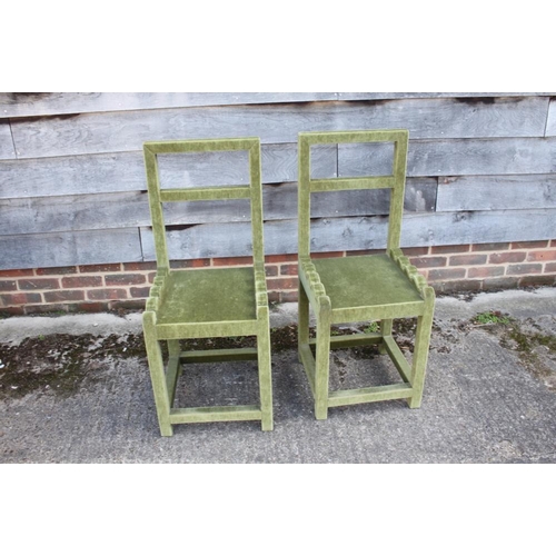 585 - A pair of green velvet covered side chairs with panel seats, on stretchered supports