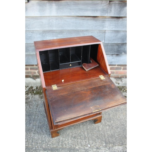 591 - An Edwardian mahogany box and ebony strung fall front bureau, the fitted interior over one long draw... 