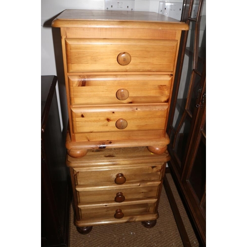 601 - A pair of pine three drawer bedside chests, on bun feet, 18