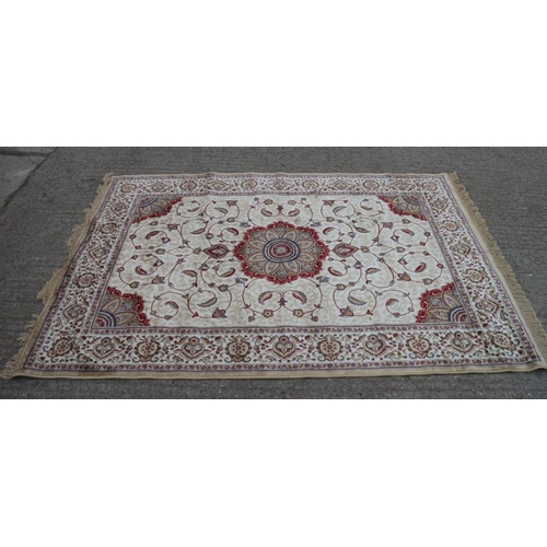 610 - A Kashmir carpet with floral medallions on a gold ground, 90