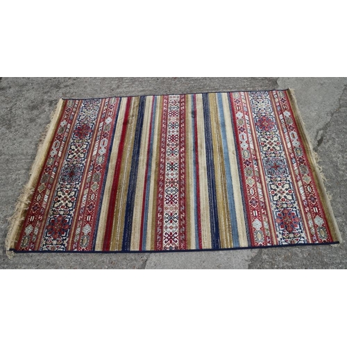 611 - A multi-coloured Kashmir carpet with all-over traditional design, 67