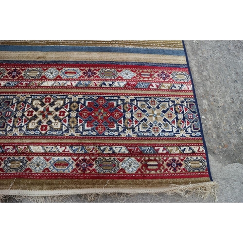 611 - A multi-coloured Kashmir carpet with all-over traditional design, 67