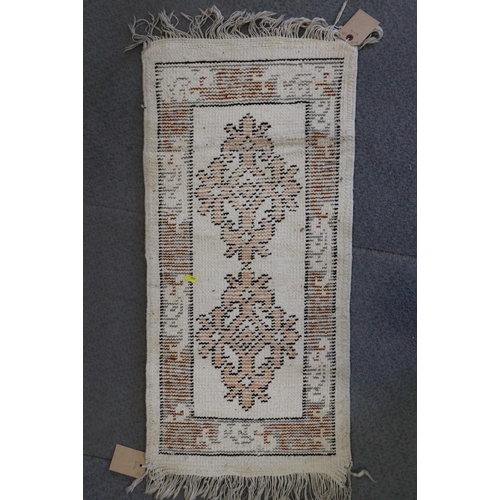 615 - A Kazak kelim rug with two hooked guls on a tan ground, 50