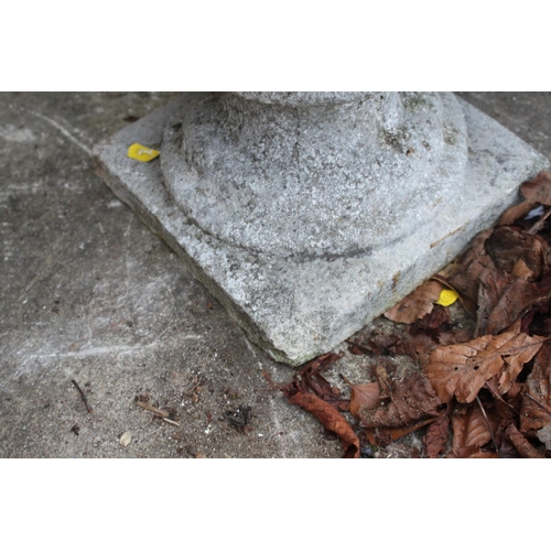 622 - A set of four cast stone planters, on square bases, 15 1/2