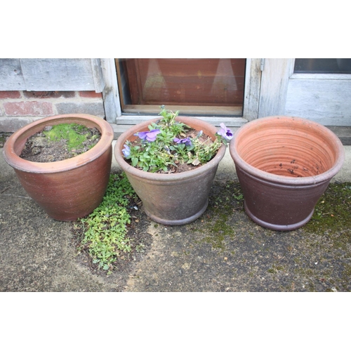 626 - A pair of tapered terracotta plant pots, 12 1/4