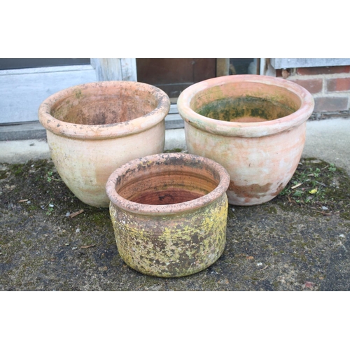 628 - A pair of bulbous terracotta plant pots, 13 3/4