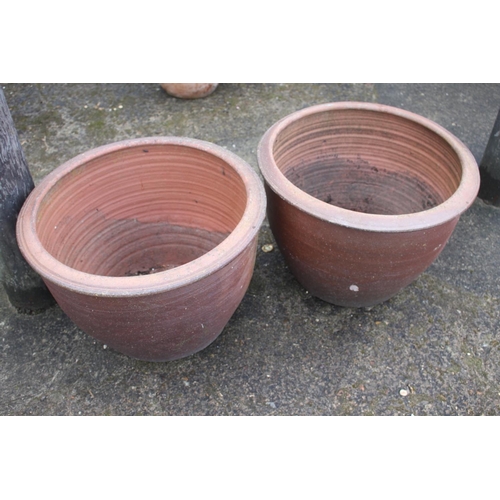 629 - A pair of bulbous terracotta plant pots, 19