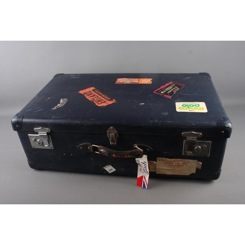 632 - A Globe Trotter suitcase with 1950s-90s labels, 29