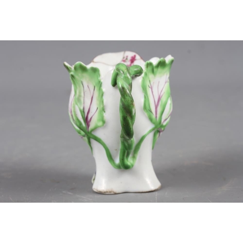 7 - A Longton Hall cream jug with openwork twist handle and leaf relief decoration and enamel floral spr... 