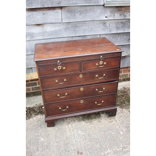 461 - A bachelor's George III mahogany chest of two short and three graduated long drawers with slide, on ... 